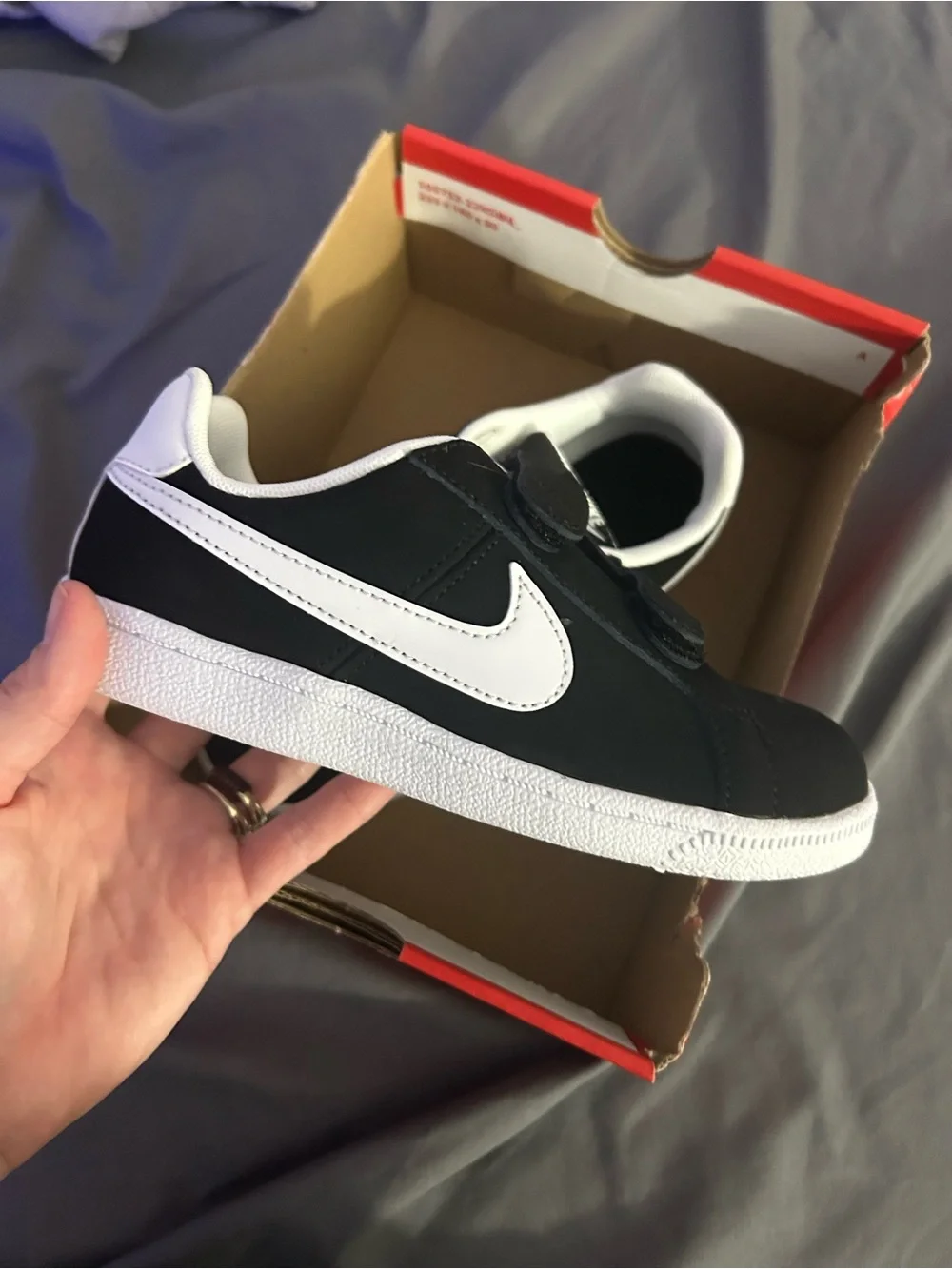 Nike Black/White youth shoes.